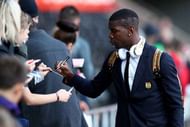SWANSEA, WALES - NOVEMBER 06:  Paul Pogba of Manchester United signs autographs prior to the Premier League match between Swansea City and Manchester United at Liberty Stadium on November 6, 2016 in Swansea, Wales.  (Photo by Michael Steele/Getty Images)